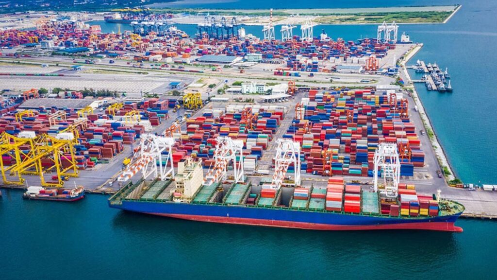 Container ship being unloaded by gantry cranes at a commercial seaport in Bangladesh